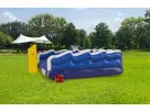 Perfect for Austin summer parties, this mechanical surf water slide rental features a realistic surfboard experience