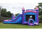 Castle bounce house with water slide rental in Houston—dual pink turrets and tunnel entrance, ideal for Cypress parties.