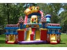 Perfect for Pflugerville parties, this colorful amusement park obstacle course rental in Austin features a kid-friendly rock wall