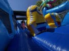 Perfect for League City parties, this 50ft Minions obstacle course rental in Houston features a wet or dry water slide with blue