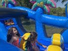 Perfect for The Woodlands parties, this 50ft Minions obstacle course rental in Houston features a wet or dry water slide setup