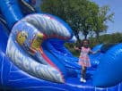 Minions 50ft water slide rental in Houston with integrated obstacle course, ideal for The Woodlands parties.