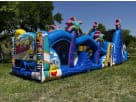 Perfect for Pasadena parties, this 50ft Minions obstacle course rental in Houston features dual slides ideal for kids' summer fun.