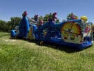 50ft Minions obstacle course water slide rental in Dallas, perfect for Fort Worth birthday parties with dual slides and character