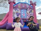 Pink Minnie Mouse bounce house combo with wet or dry slide rental in Houston, ideal for Pearland birthday parties.