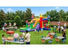 Perfect for Dallas summer parties, this colorful rainbow bounce house rental features a wet or dry water slide with vibrant
