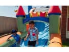 Perfect for Houston kids' parties, this colorful castle bounce house rental features a wet or dry water slide with dual slides