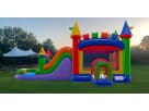 Colorful rainbow bounce house with water slide rental in Dallas, wet or dry combo ideal for Plano summer parties.