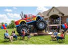Perfect for Dallas birthday parties, this monster truck bounce house rental features a large bouncing area with realistic black