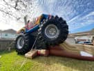 Monster Truck Deluxe Bounce House en renta en Houston con tobogán grande, ideal para fiestas en The Woodlands.