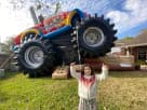 Perfect for Dallas birthday parties, this monster truck bounce house rental features a large bouncing area with realistic tires