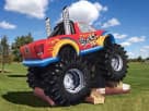 Monster Truck Deluxe bounce house rental in Dallas with slide, ideal for Frisco kids' parties and events.