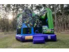 Perfect for Dallas birthday parties, this Ninja Turtles 5in1 bounce house rental features dual slides ideal for kids ages 3-12.