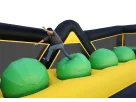 Toxic Run Wipe-Out Challenge obstacle course rental in Austin — yellow and black inflatable with interactive bumps