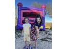 Vibrant purple and pink bounce house rental in Dallas, ideal for Frisco outdoor summer parties.