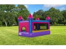 Pink and purple castle bounce house rental in Austin, ideal for toddlers and small children at outdoor parties in Buda.