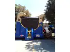Austin police pup bounce house rental with climbing wall and slide attachment, perfect for Georgetown celebrations.