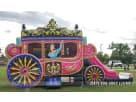 Princess carriage bounce house rental in Houston with dual slides, ideal for Sugar Land birthday parties and outdoor events.