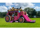 Princess carriage bounce house rental in Houston with dual slides, ideal for birthday parties in Spring.