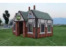 Perfect for Houston college parties, this Tudor-style inflatable Pub rental features a charming brick facade