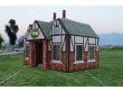 Perfect for Houston college parties, this Tudor-style inflatable Pub rental features a charming brick facade