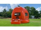 Pumpkin bounce house rental in Dallas with bright orange and green colors, ideal for fall parties in Plano.