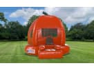 Bright orange pumpkin bounce house rental in Dallas with green stem detail, perfect for fall festivals and Fort Worth events.
