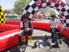 Tricycle Race Track rental in Dallas with two riding toys — perfect for interactive kids' parties in Arlington.