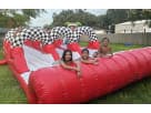 3 Lane Racing Slip N Slide water slide rental in Austin with triple lane design ideal for Pflugerville summer parties.