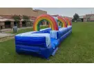 Rainbow Slip N Slide water rental in Austin with multiple lanes—ideal for Round Rock summer parties.