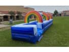 Rainbow Slip N Slide water rental in Dallas with colorful arch tunnels, ideal for McKinney summer events and kids of all ages.