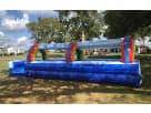 Perfect for Dallas summer parties, this Rainbow Slip N Slide rental features dual lanes and colorful arches ideal for kids of all