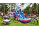 Rainbow unicorn water slide rental in Houston with dual slides and splash pool, ideal for Kingwood birthday parties.