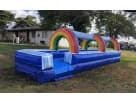 Tobogán acuático Rainbow con túneles inflables disponible para renta en Austin — perfecto para fiestas en Georgetown.