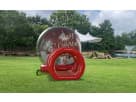 Inflatable Christmas tunnel bounce house con luces disponible para renta en Austin — perfecto para fiestas navideñas en Buda.