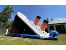 Perfect for Dallas school events, this Titanic-themed dual lane dry slide rental features a 33ft high slide ideal for ages 10+.