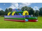 Colorful 34ft water slide rental with obstacle course sections displayed at a Houston park, ideal for Conroe parties.