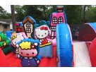 Hello Kitty toddler bounce house rental in Austin with castle towers and slide, ideal for Georgetown birthday parties.