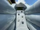 Renta de obstáculos Black Ops con rockwall y tobogán dual en Austin—ideal para fiestas temáticas militares en Kyle.