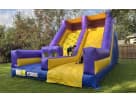 Dual-slide inflatable rockwall rental in Austin with climbing wall and slides, ideal for Round Rock birthday parties and backyard