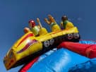 Rocket-themed inflatable water slide rental in Austin perfect for Buda backyard parties under sunny skies.