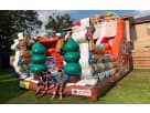 Perfect for Pflugerville holiday parties, this 20ft Christmas Santa Claus dual lane slide rental in Austin features festive