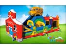 School bus–themed obstacle course rental in Houston with dual slides and climbing wall, perfect for Spring birthday parties.