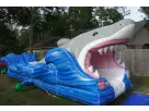 Perfect for Cedar Park summer parties, this 30-foot Shark Slip and Slide rental in Austin features a lifelike shark design