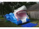 Blue and white shark slip and slide rental in Dallas backyard, 30 feet long water slide ideal for McKinney summer parties.