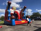 Basketball-themed bounce house rental in Austin with dual free throw games, perfect for Georgetown parties and interactive