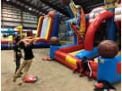 Blue and red basketball shootout interactive game rental in Houston, with dual slides ideal for kids' parties in The Woodlands.