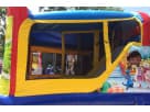 Doc McStuffins bounce house with wet or dry slide rental in Austin, featured at a residential party setup in Pflugerville.