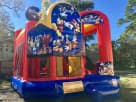 Perfect for Austin birthday parties, this Mickey Mouse bounce house rental features dual slides and castle towers ideal for kids