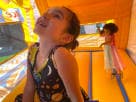 Ice Cream Truck bounce house rental in Austin with bright orange and yellow inflatable design, perfect for Cedar Park birthday